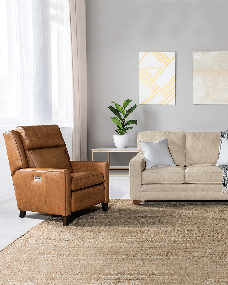 Close-up of woodworking tools with wooden handles, placed on a marked wooden surface, used for crafting solid wood furniture.