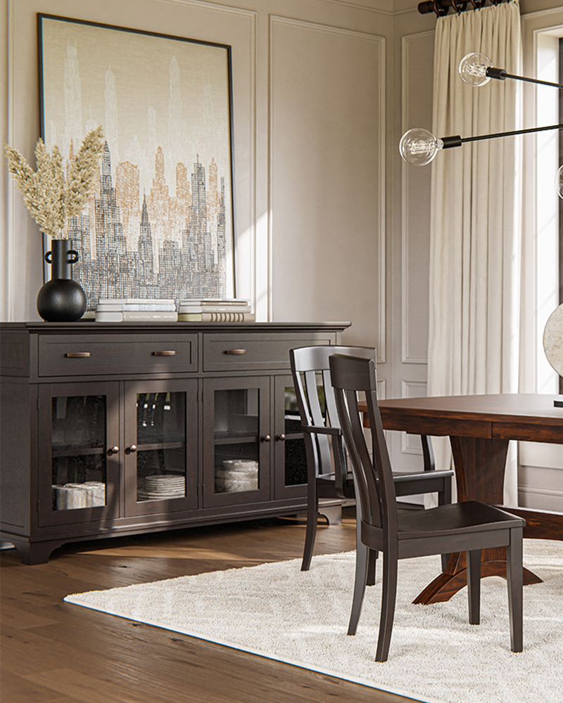 Dark wood dining room furniture with buffet cabinet, table, and chairs.