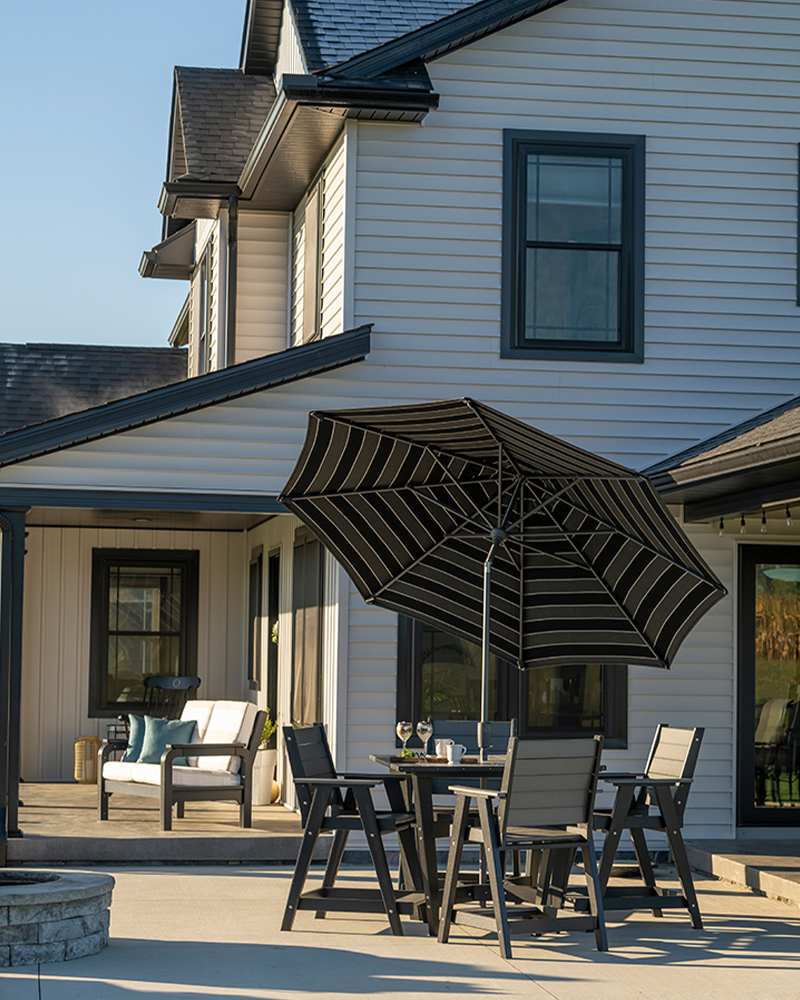 Close-up of woodworking tools with wooden handles, placed on a marked wooden surface, used for crafting solid wood furniture.