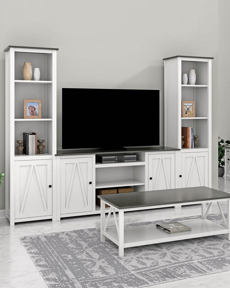 Exterior view of Heirloom Amish Furniture store, showing the storefront with signs and outdoor furniture displayed along the sidewalk.