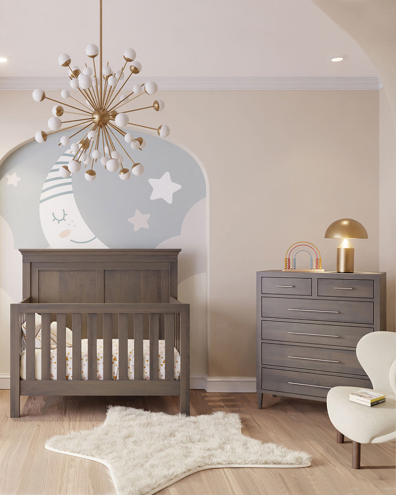 Solid wood nursery furniture with crib and dresser in a soft, modern room.