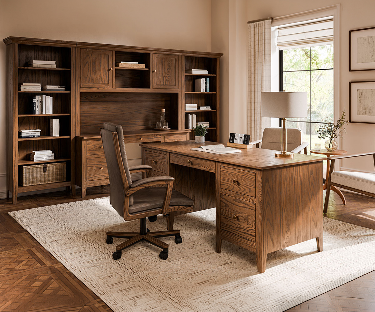 Warm bedroom featuring solid wood furniture, including a Craftsman-style bed frame, matching nightstands, and a chest of drawers in a rich brown finish.