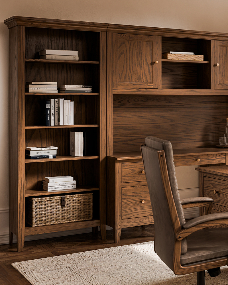 Exterior view of Heirloom Amish Furniture store, showing the storefront with signs and outdoor furniture displayed along the sidewalk.