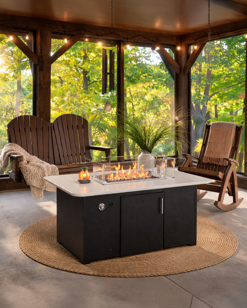 Exterior view of Heirloom Amish Furniture store, showing the storefront with signs and outdoor furniture displayed along the sidewalk.
